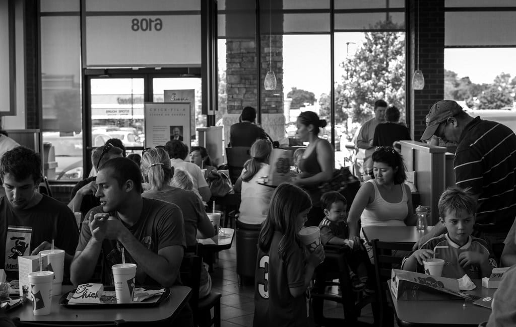 Chick-fil-A restaurant storefront with customers outside