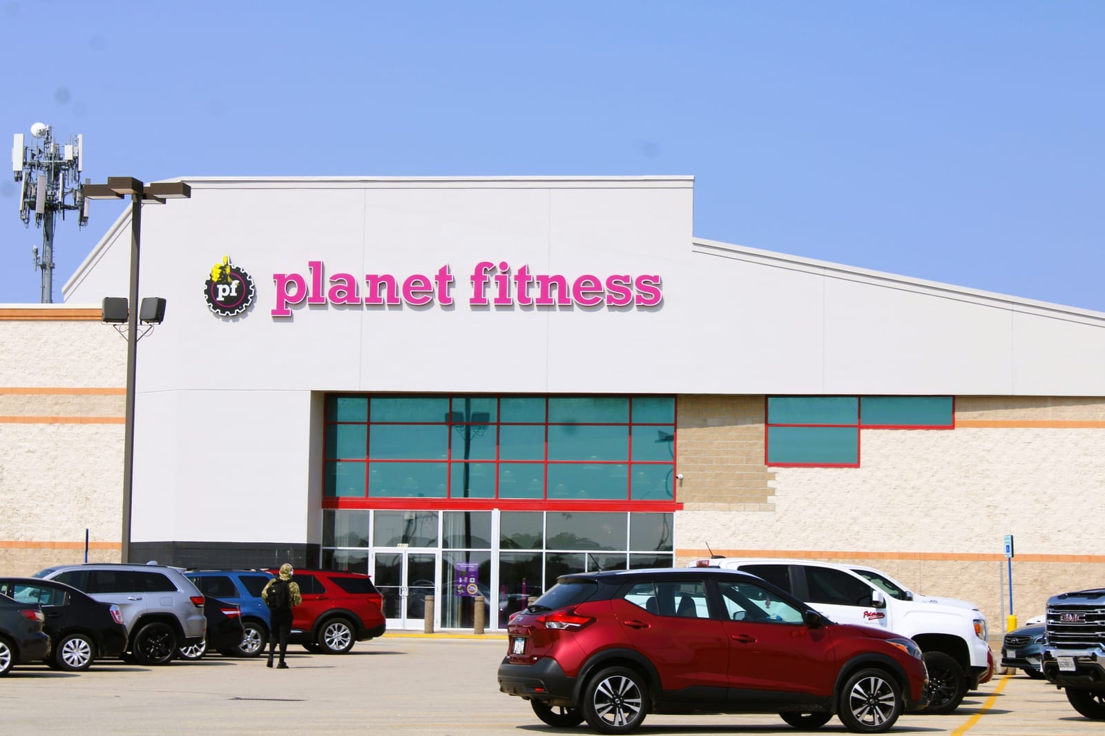Planet Fitness storefront exterior with purple and yellow branded signage