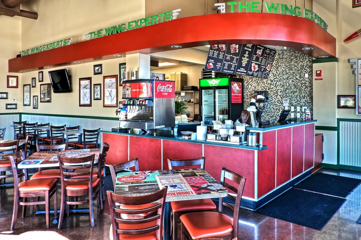 Interior of a Wingstop restaurant showing the order counter and dining area